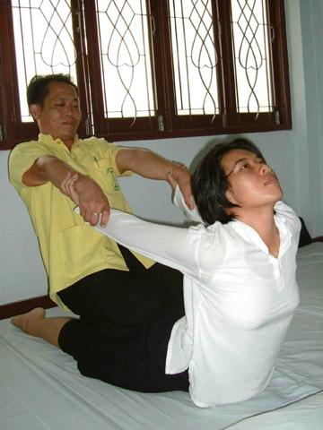 Thai massage at Wat Po, Bangkok, Thailand.