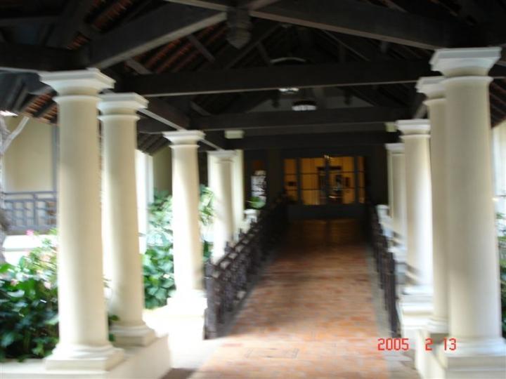 Colonnaded esplanade leading between the two pools. Beginning in 1996, under the sponsorship of Raffles International Limited, the main building was renovated, restored, and refurbished.
