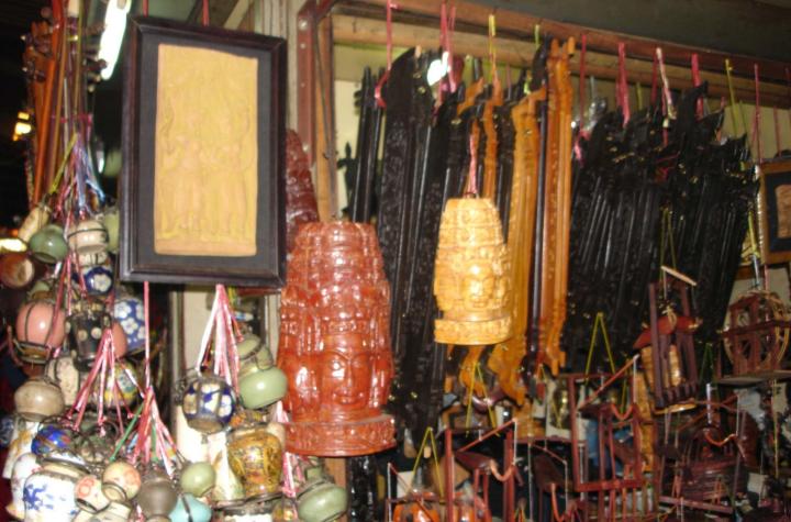 Opium pipes, picture frames, and carvings. Phnom Penh, Cambodia.