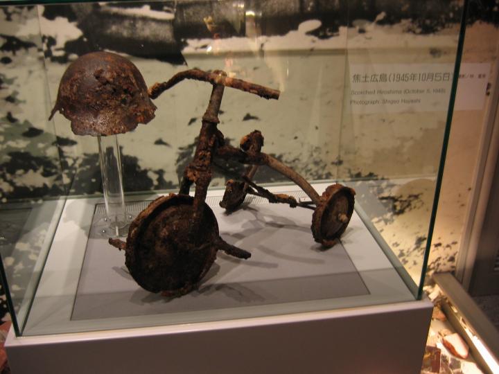 After the bombing of Hiroshima a father buried his son with his tricycle. 