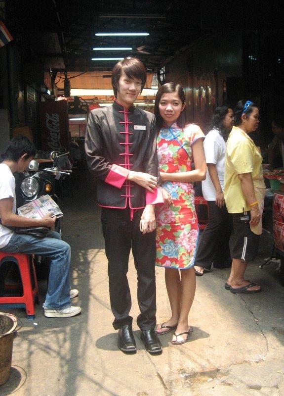 A couple in Chinatown, dressed in the height of fashion