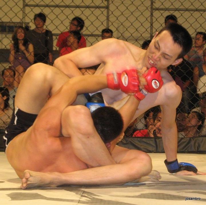 a classic triangle hold with his legs