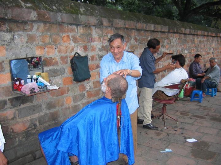 A barbershop on the streets of Hanoi