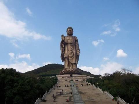 The Great Buddha at Lingshan is 88 meters tall. The whole body was made of bronze which weighs 700 tons. It is so far the biggest open air Buddha statue in the world.