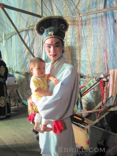 Backstage with a Chinese opera troupe in Penang, Malaysia    This baby’s bed is a backstage bassinet, and he has already heard more Chinese operas in his short lifetime than most of us ever will.