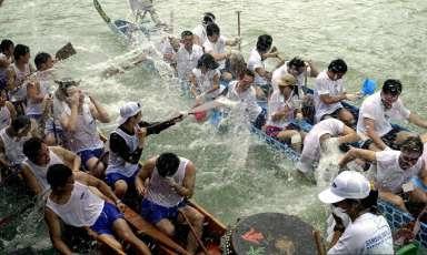 There was an air of camaraderie at the dragon boat festival in the Sai Kung district of Hong Kong, 25 June 2001 when competitors ended off their race by splashing water on each other with their paddles. The event, also known as Tuen Ng Festival, dates back 2000 years and is held on the fifth day of the fifth lunar month. Hong Kong celebrates this public holiday in a big way, with races all over the city and new territories.