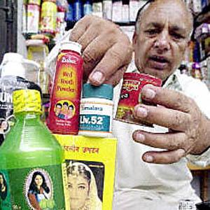 A Pakistani shop-owner arranges Indian cosmetics at his shop in the 'Indian bazaar' in the eastern Pakistani city of Lahore.