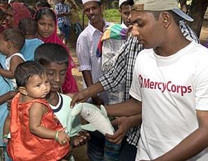 Mercy Corps, handing out toys in Sri Lanka.