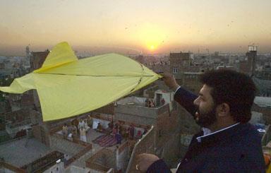 A man flies a kite at sunset after a day-long kite flying festival, locally known as 'Basant', in Pakistan's eastern city of Lahore, 09 February 2003, as officials said around 100,000 people from inside and outside the country had arrived in the city to celebrate the occasion. Two people died and more than 100 were injured during the annual kite flying festival marking the advent of spring in Pakistan. Public parks and rooftops were crowded with revellers celebrating the festival which started with music concerts and dinner parties organized privately or as public events late Saturday. A man flies a kite at sunset after a day-long kite flying festival, locally known as 'Basant', in Pakistan's eastern city of Lahore, 09 February 2003, as officials said around 100,000 people from inside and outside the country had arrived in the city to celebrate the occasion. Two people died and more than 100 were injured during the annual kite flying festival marking the advent of spring in Pakistan. Public parks and rooftops were crowded with revellers celebrating the festival which started with music concerts and dinner parties organized privately or as public events late Saturday.