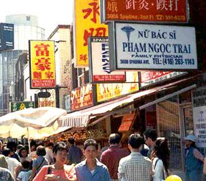 Shop signs reveal the growing Vietnamese presence in Toronto's Chinatown.