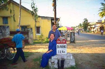 Taking a break from the long drive. A French road marker (found all along Highway One) alongside the road to Danang.