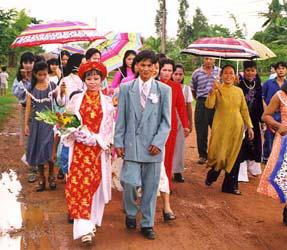 The wedding procession to the bride's house. Vietnamese weddings are far more participatory than traditional western weddings.