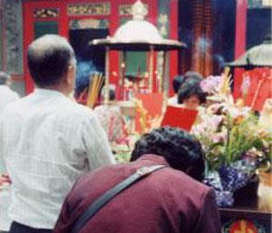 Worshipping at Lungshan Temple, Taipei. Religion is just one example of Chinese influence on Taiwanese life.