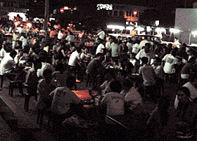 Hundreds of people at a mamak stall