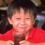Boy in coffee shop, street centre, Pulau Ubin