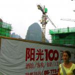 The cranes rise higher than the hills in Yangshuo