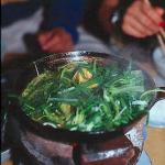 Braised fish sautéed with fresh herbs at the Cha Ca La Vong Restaurant, Hanoi, Vietnam.