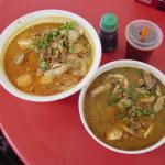 Curry seafood noodles (left) and tom yam seafood noodles (right)