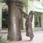 the bronze statue of a child posting letter in Shamian Island