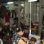 Textile workers at sewing machines. Phnom Penh, Cambodia.