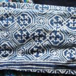 Indigo batik on cotton. This intricate design has been recycled - once used in a skirt, it's now used as straps on a baby-carrier that has been used for a half-dozen children. 