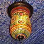 Colorful lanterns in mosaic glass adorn the painted ceilings that have been restored with passion. 