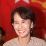 Burmese democracy leader Aung San Suu Kyi smiles at a question during a press conference in Yangon in 2002.