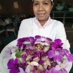 A Thai chef shows an orchid salad made with flowers at a restaurant at the Rose Garden resort in Nakhon Pathom province.