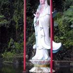 A statue of the deity, Kuan Yin, welcoming visitors at the entrance.