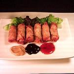 Tiny Egg Rolls with Hot Mustard, Hoisin Sauce, and Sweet & Sour Sauce.