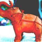 This fine terracotta elephant stands to attention among many unique example by one of the islands younger potters.