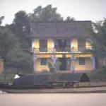 A yellow house on the bank of the Perfume River, Hue.