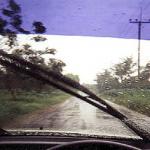 A rainstorm in southern Thailand seen from behind the wheel.