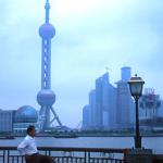 Shanghai. Exercising on the Bund, with Pudong in the background, across the river.